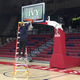 Penn senior Sam Jones cuts down the nets at The Palestra early Sunday morning.
